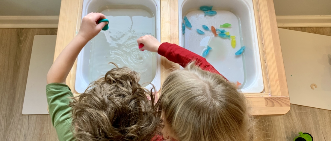 Kids playing with ice and water