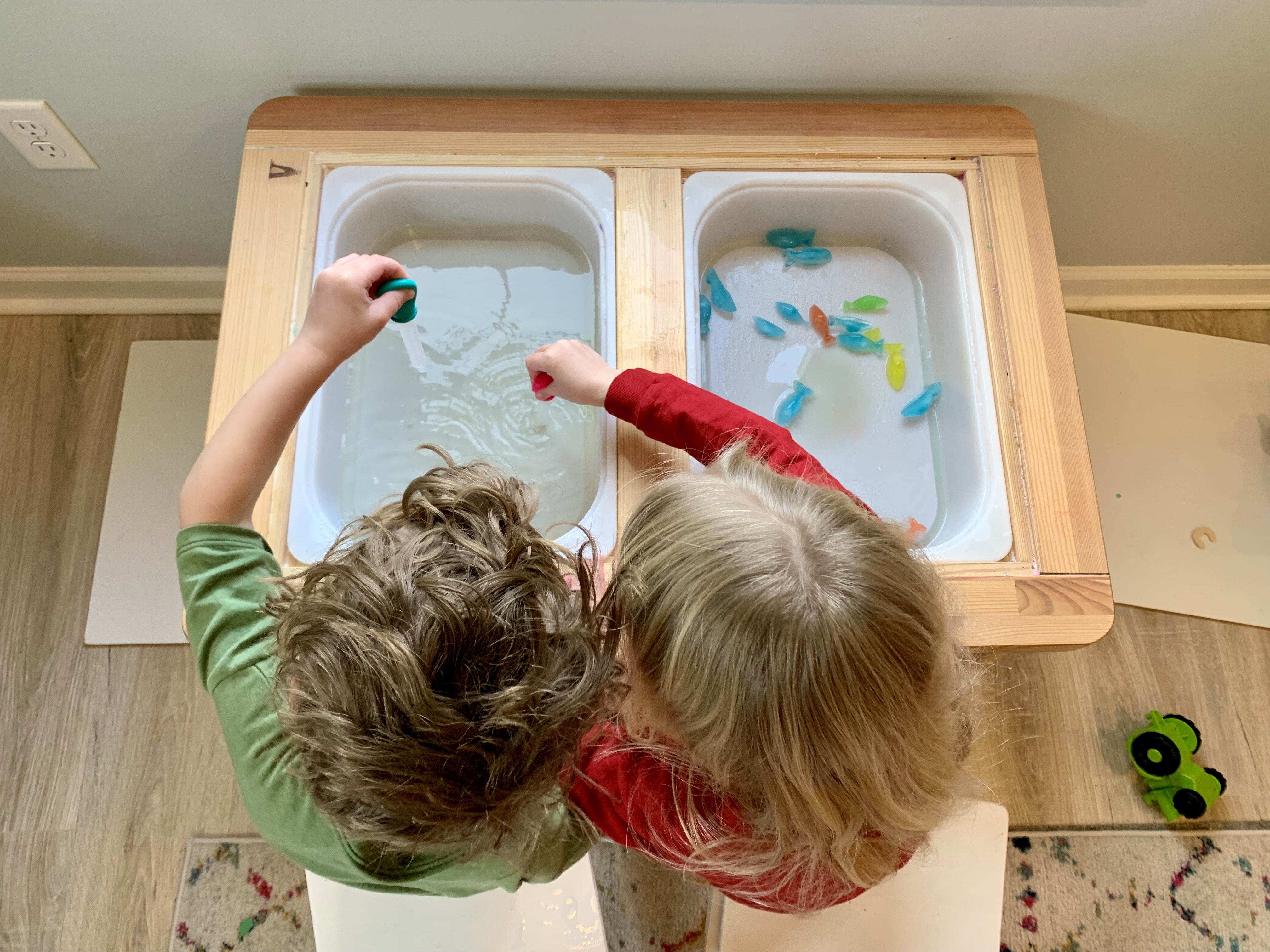 Kids playing with ice and water