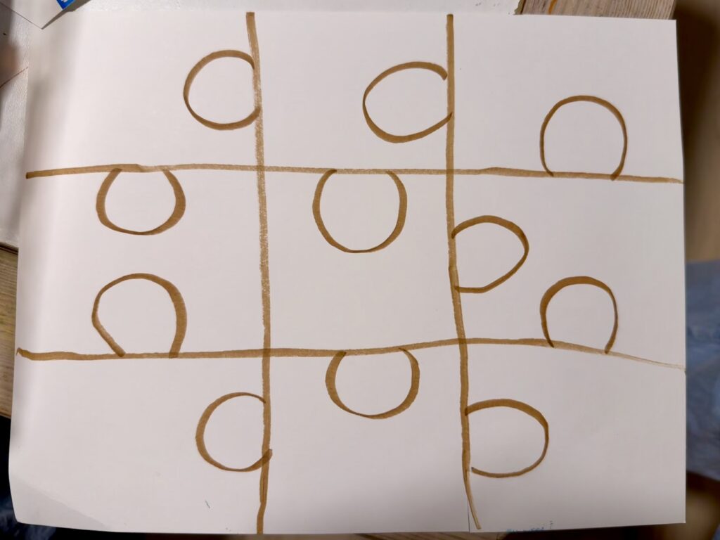 Photo of a piece of paper with puzzle pieces drawn on the back in honor of National Puzzle Day