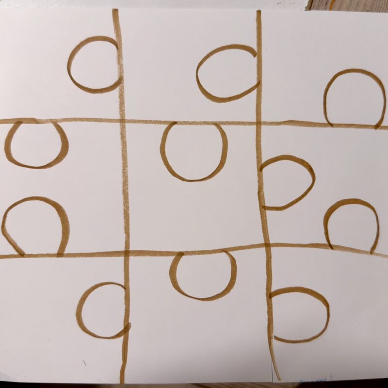 Photo of a piece of paper with puzzle pieces drawn on the back in honor of National Puzzle Day