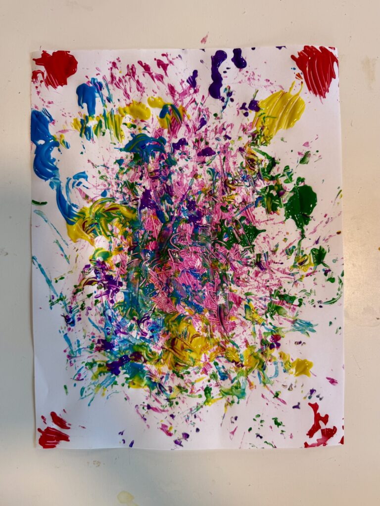 White paper painted in multiple colors, streaks, smears, splatters. 