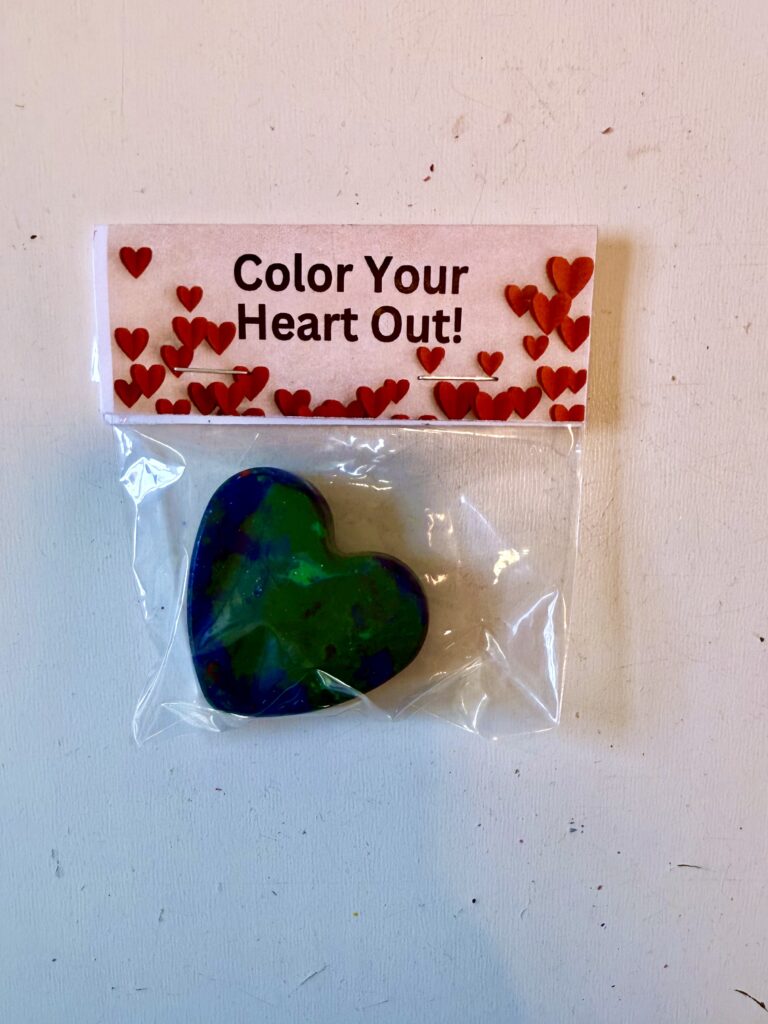 Heart Shaped Crayon in a bag as a Valentine, Bag topper reads "Color Your Heart Out"